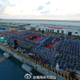 The audience gathers on Fiery Cross Reef in the Spratly archipelago.